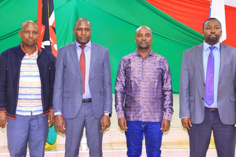 CPA Benard Chheruiyor pose for a photo alongside Bomet Governor Prof Hillary Barchok and speaker Cosmas Korir after his swearing in.