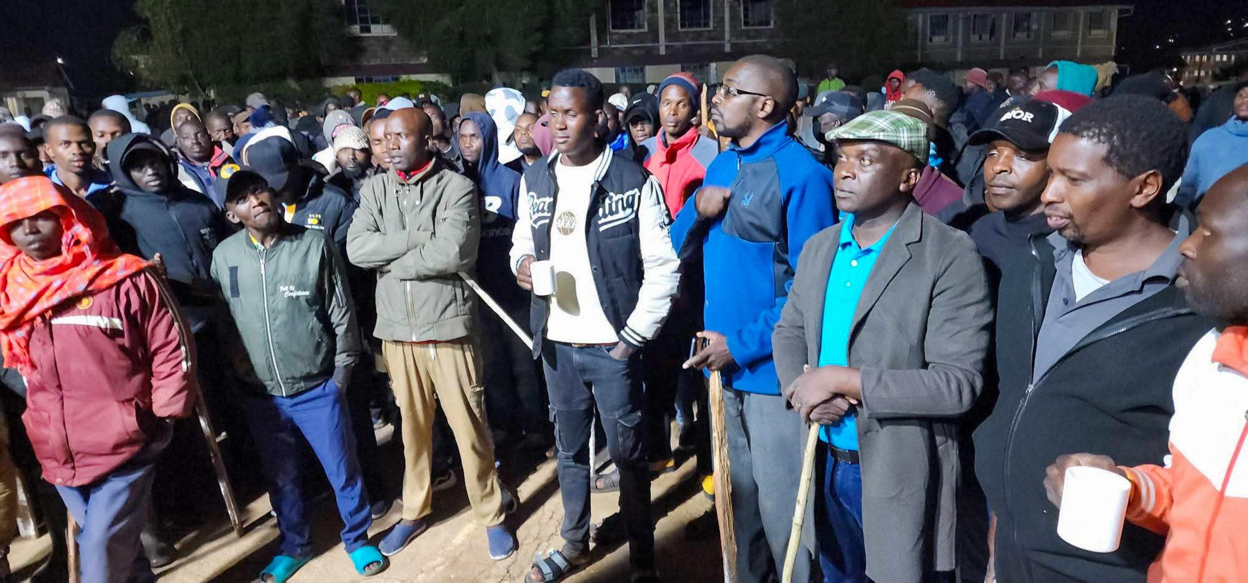 Members o fthe public kept vigil the who night at Tengecha Boys after students went on rampage an dburning down a storey dormitory who hosted more than 100 students. No student was injured during the incident. Photo/File